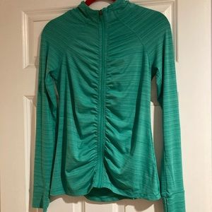 Athleta XS Fitted Green zip up with zipper pocket on back